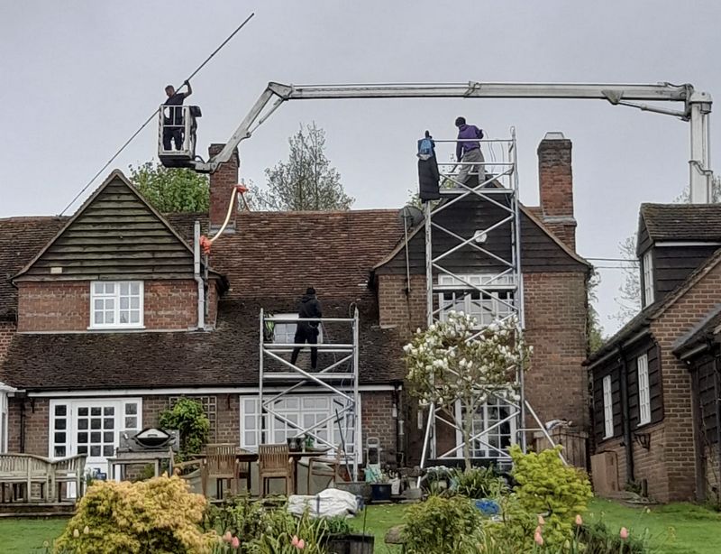The Moss Cleaners using cherry picker and scaffolding to clean roof safely and professionally in 49 Lower Boston Rd, London W7 3TP, UK, 49 Lower Boston Rd, London W7 3TP, UK